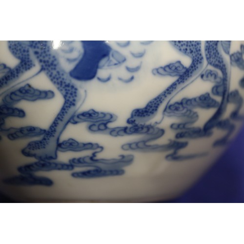 74 - A Chinese blue and white bulbous vase, decorated figures on clouds and four character mark to base, ... 