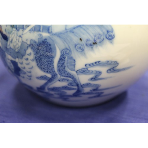 74 - A Chinese blue and white bulbous vase, decorated figures on clouds and four character mark to base, ... 