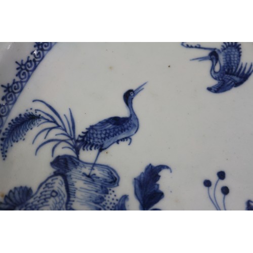 75 - A Chinese blue and white platter, decorated birds, a tree and a fence, 16 1/2