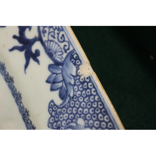 75 - A Chinese blue and white platter, decorated birds, a tree and a fence, 16 1/2