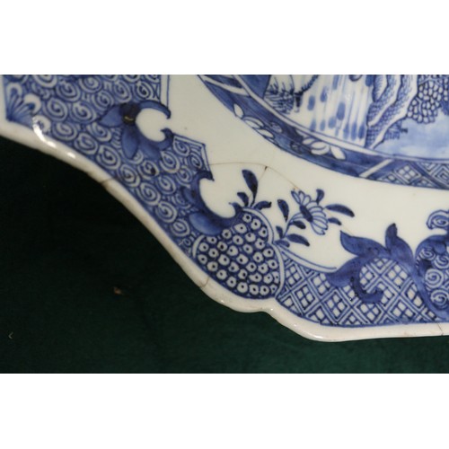 75 - A Chinese blue and white platter, decorated birds, a tree and a fence, 16 1/2