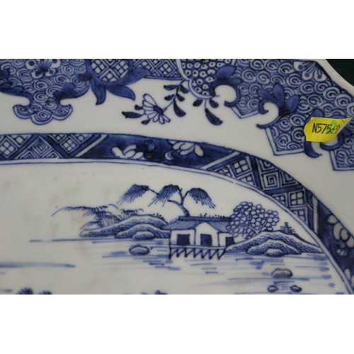 75 - A Chinese blue and white platter, decorated birds, a tree and a fence, 16 1/2