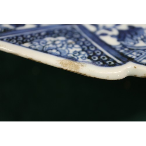 75 - A Chinese blue and white platter, decorated birds, a tree and a fence, 16 1/2