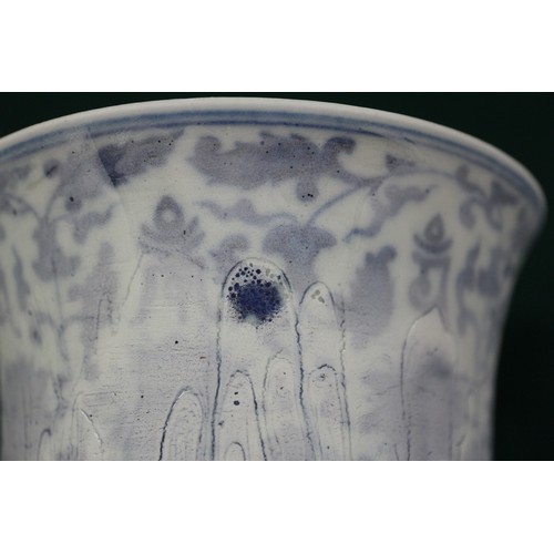 84 - A Chinese porcelain blue and white stem cup with faulty glaze, 4 1/8