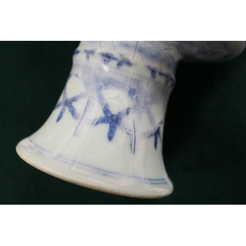 84 - A Chinese porcelain blue and white stem cup with faulty glaze, 4 1/8