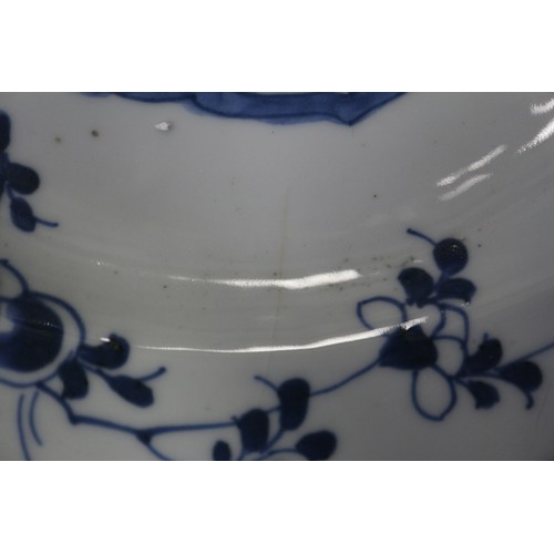 70 - A Chinese blue and white bowl with lotus flower and scrolled decoration, six character mark to base,... 