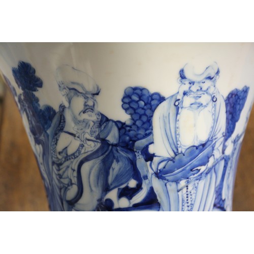 67 - A pair of Chinese blue and white flared vases with figures in a landscape decoration, 16