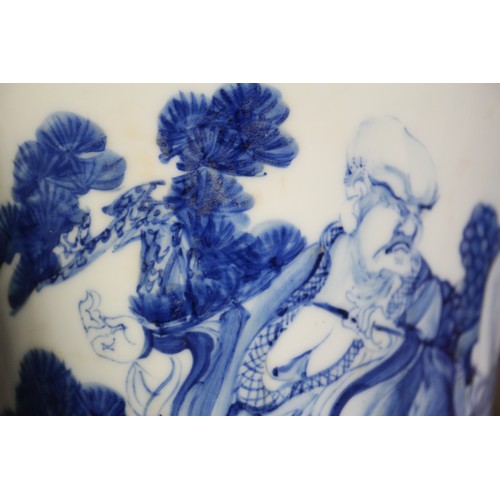 67 - A pair of Chinese blue and white flared vases with figures in a landscape decoration, 16