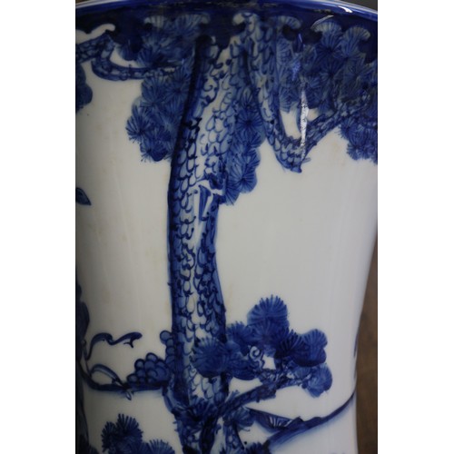 67 - A pair of Chinese blue and white flared vases with figures in a landscape decoration, 16