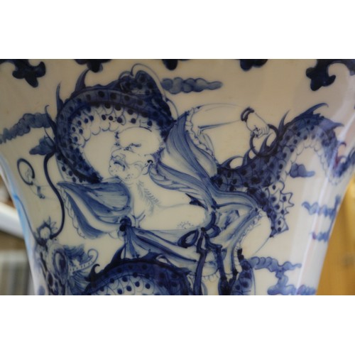 67 - A pair of Chinese blue and white flared vases with figures in a landscape decoration, 16