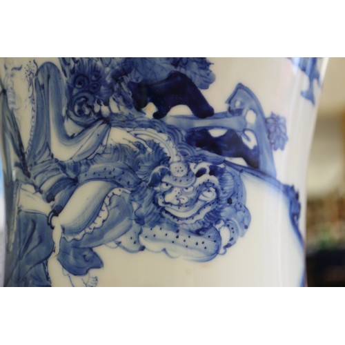 67 - A pair of Chinese blue and white flared vases with figures in a landscape decoration, 16