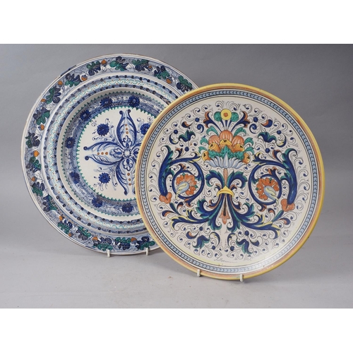 1 - A Mariucci Deruta polychrome enamel charger with traditional grotesque decoration, 14