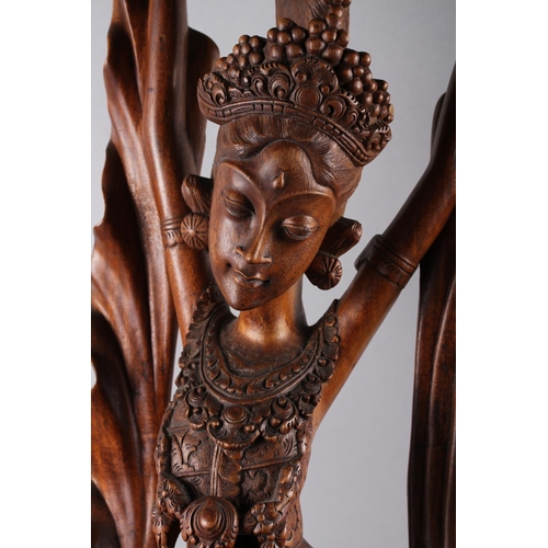 149 - A Balinese carved hardwood figure of a dancer, 39