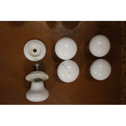 171 - A collection of approximately twelve pairs of white porcelain door knobs