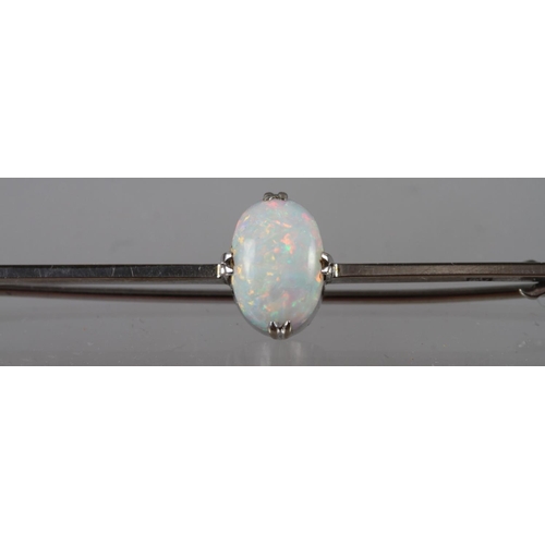 296 - A 9ct white gold bar brooch set oval milk opal