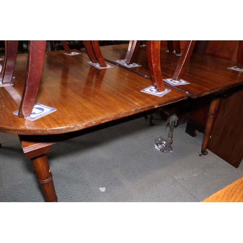 414 - A 19th century mahogany extending dining table with one extra leaf, on faux bamboo turned and castor... 