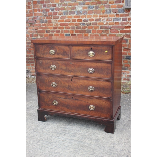 436 - A 19th century figured mahogany chest of two short and three long graduated drawers with oval brass ... 