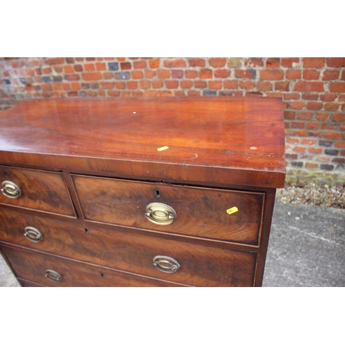 436 - A 19th century figured mahogany chest of two short and three long graduated drawers with oval brass ... 