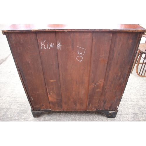 436 - A 19th century figured mahogany chest of two short and three long graduated drawers with oval brass ... 