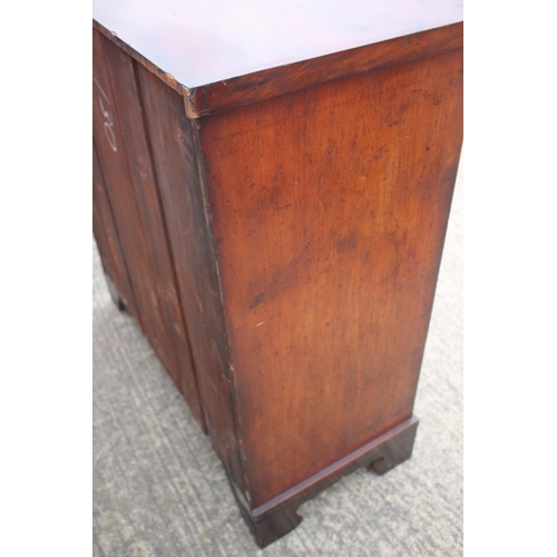 436 - A 19th century figured mahogany chest of two short and three long graduated drawers with oval brass ... 