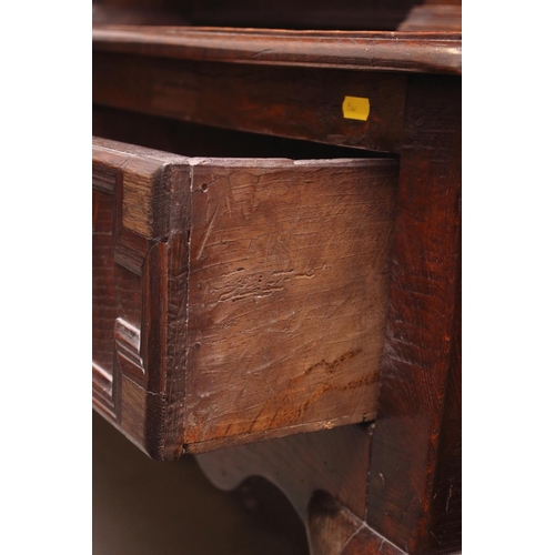 437 - A 19th century oak dresser, the upper section fitted open shelves and cupboards enclosed panelled do... 