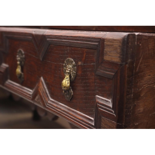 437 - A 19th century oak dresser, the upper section fitted open shelves and cupboards enclosed panelled do... 