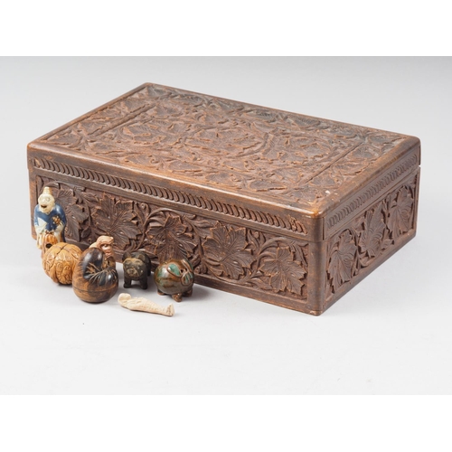 100 - An Oriental carved hardwood box, 12