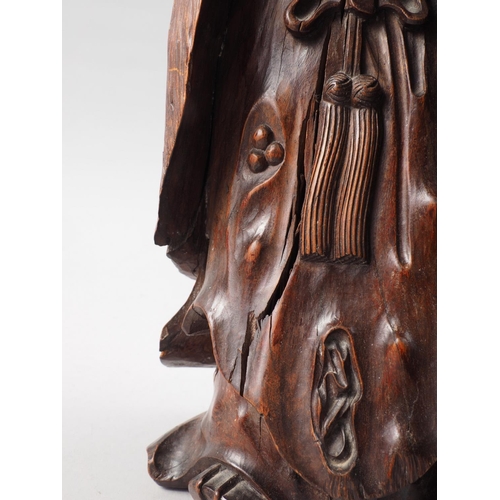 103 - A Chinese carved fruitwood figure of a Laotsu, on root stand, 26 1/2