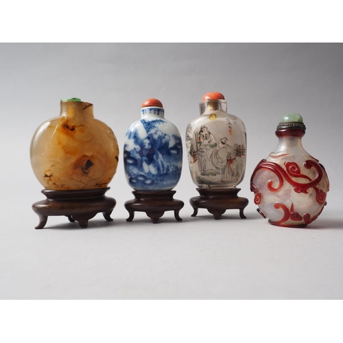 109 - A Chinese internal painted snuff bottle with coral stopper, 2 3/8