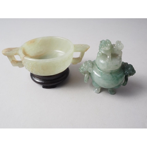 110 - A carved jade two-handled vessel, 4 1/8