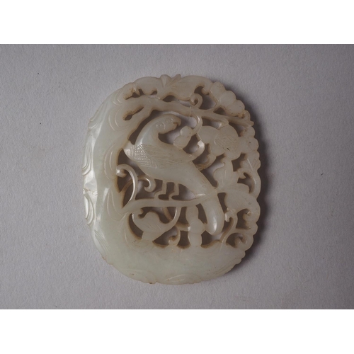 113 - A phoenix carved jade panel, 2 3/4