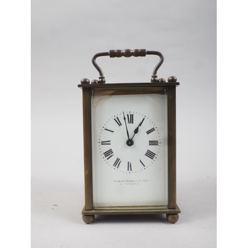 127 - A carriage clock with white enamel dial, supplied by Stuart Dawson & Co Ltd, Hatton Garden, 4