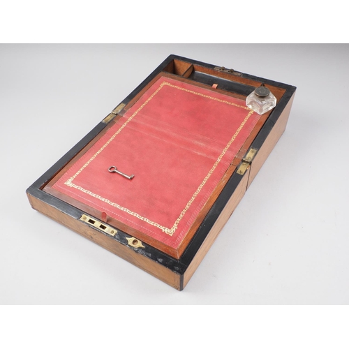 151 - A walnut and brass mounted writing box with fitted interior, 16