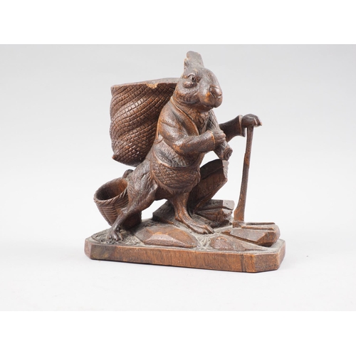 152 - A black forest carved wood model of a rabbit woodcutter, 8