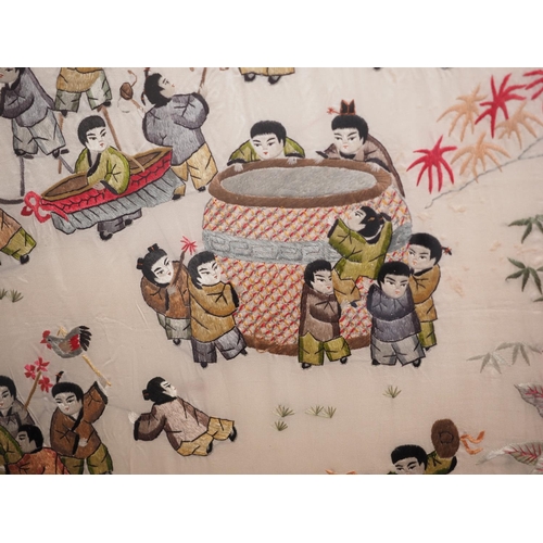 168 - A Chinese silk embroidered panel, festival scenes, 65 1/2