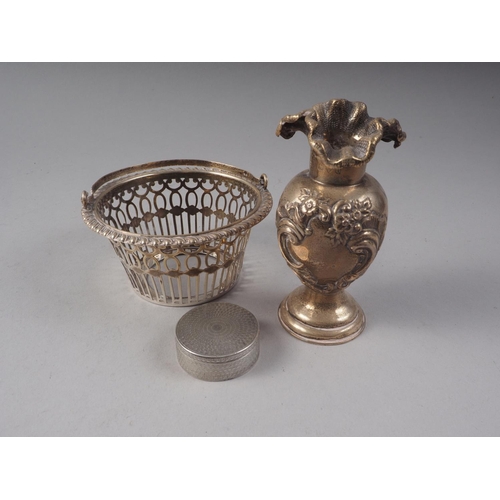 233 - A silver openwork bonbon basket, 1.7oz troy approx, an engine turned white metal patch box and an em... 