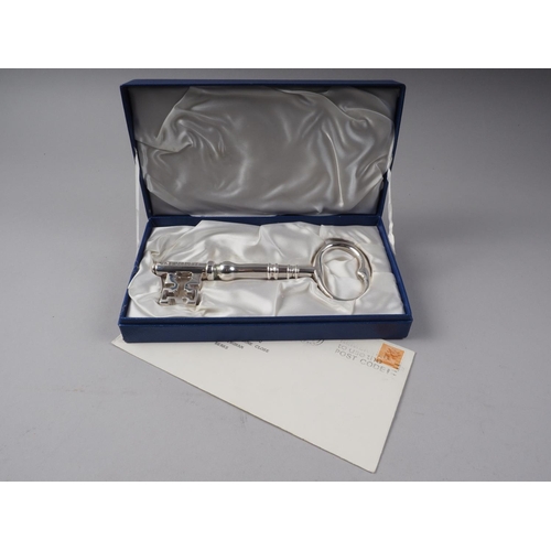 248 - A silver presentation key with Jubilee hallmark, in box, 11.9oz troy gross