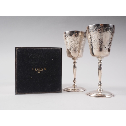 260 - A pair of silver goblets with engraved decoration, 4 3/4