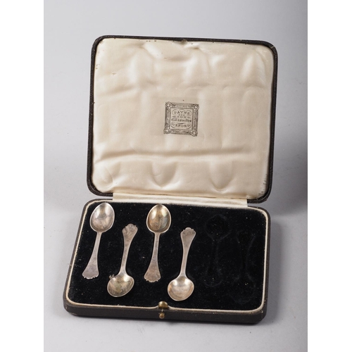 274 - A silver spoon and pusher, in fitted case, a part set of silver coffee spoons, in fitted case, a set... 