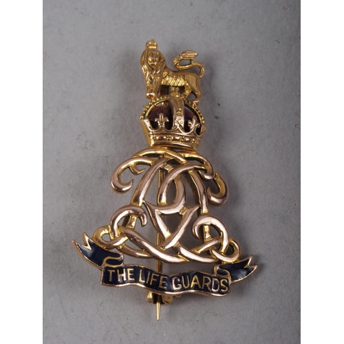 294 - A 9ct gold and enamel Life Guards sweetheart brooch, 4.3g, and a yellow metal bar brooch