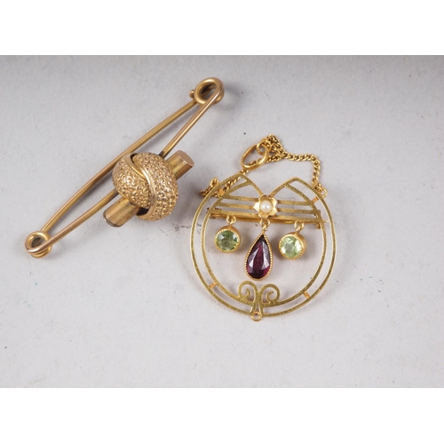 309 - A 19th century yellow metal bar brooch, 3.6g, and a 9ct gold, garnet, seed pearl and peridot brooch/... 