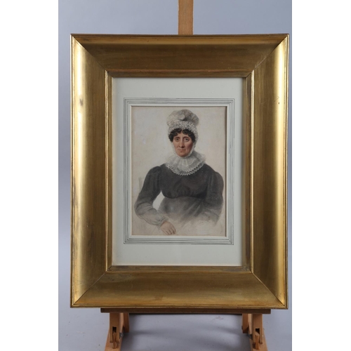 354 - An early 19th century watercolour portrait of a woman with mop cap and lace collar, 9 1/4