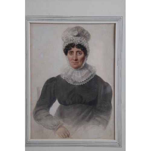 354 - An early 19th century watercolour portrait of a woman with mop cap and lace collar, 9 1/4