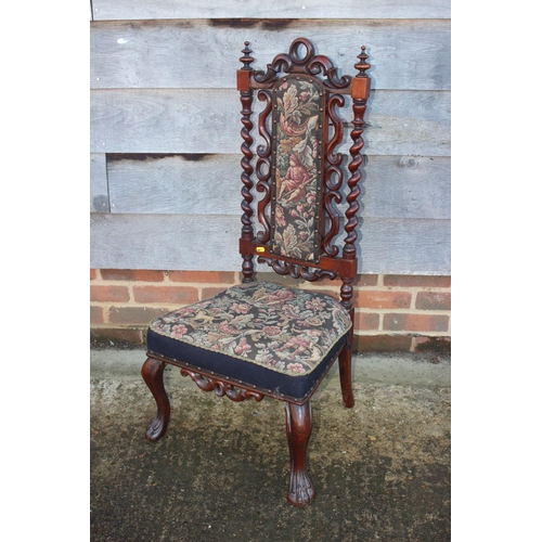 413 - A 19th century carved rosewood framed low seat nursing chair with tapestry panel back and seat, on c... 