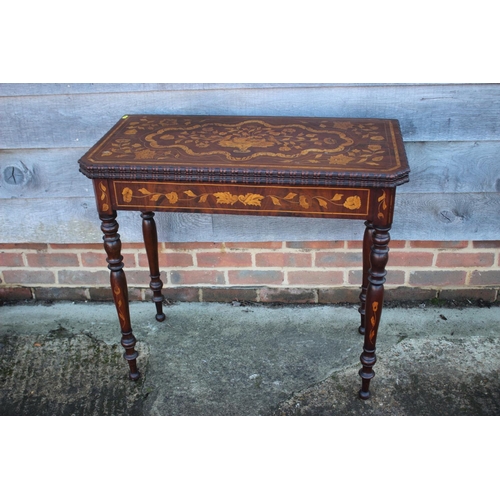 418 - A walnut and floral marquetry card table, on turned supports, 33