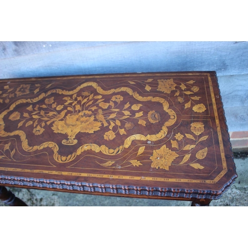 418 - A walnut and floral marquetry card table, on turned supports, 33