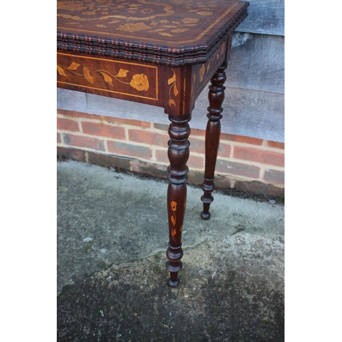 418 - A walnut and floral marquetry card table, on turned supports, 33