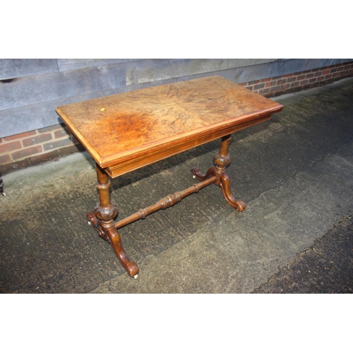 420 - A 19th century figured walnut quartered top fold-over top card table, on turned and carved splay sup... 