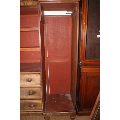 421 - An early 19th century figured mahogany double sentry box wardrobe, the centre section fitted slides ... 