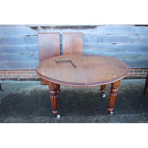 426 - A 19th century mahogany wind out 'D' end dining table with two extra leaves, on turned, reeded and c... 